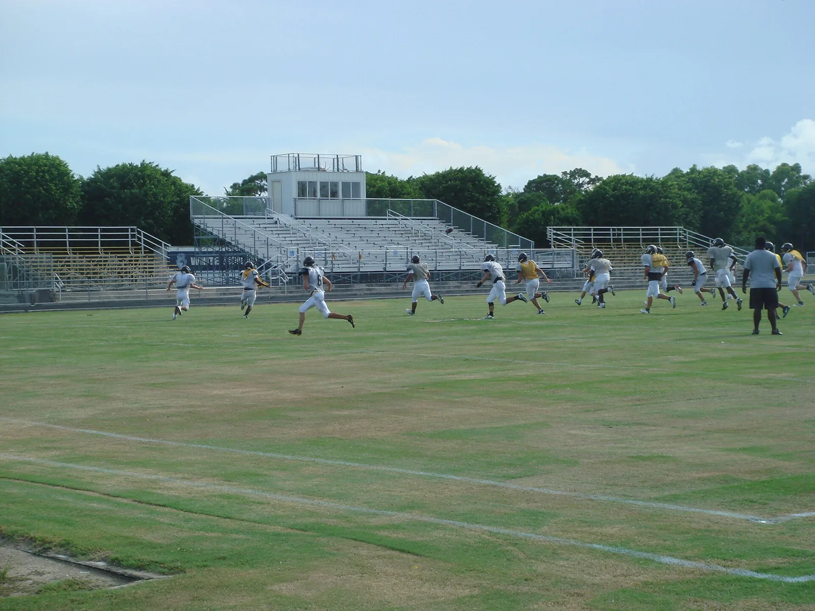 Football practice on a high school field in Boca Raton, elsewhere in Palm Beach County.