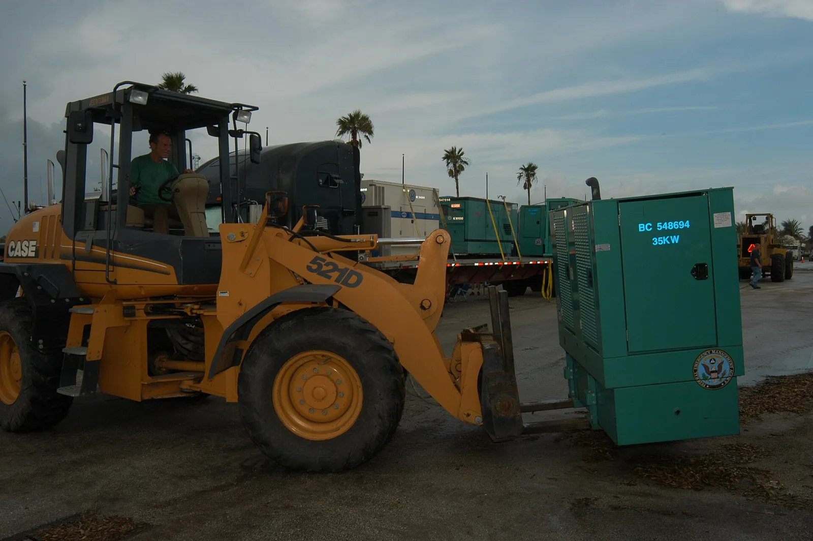 Workers ready generators at the South Florida Fairgrounds staging area west of West Palm Beach after Hurricane Frances in September 2004.