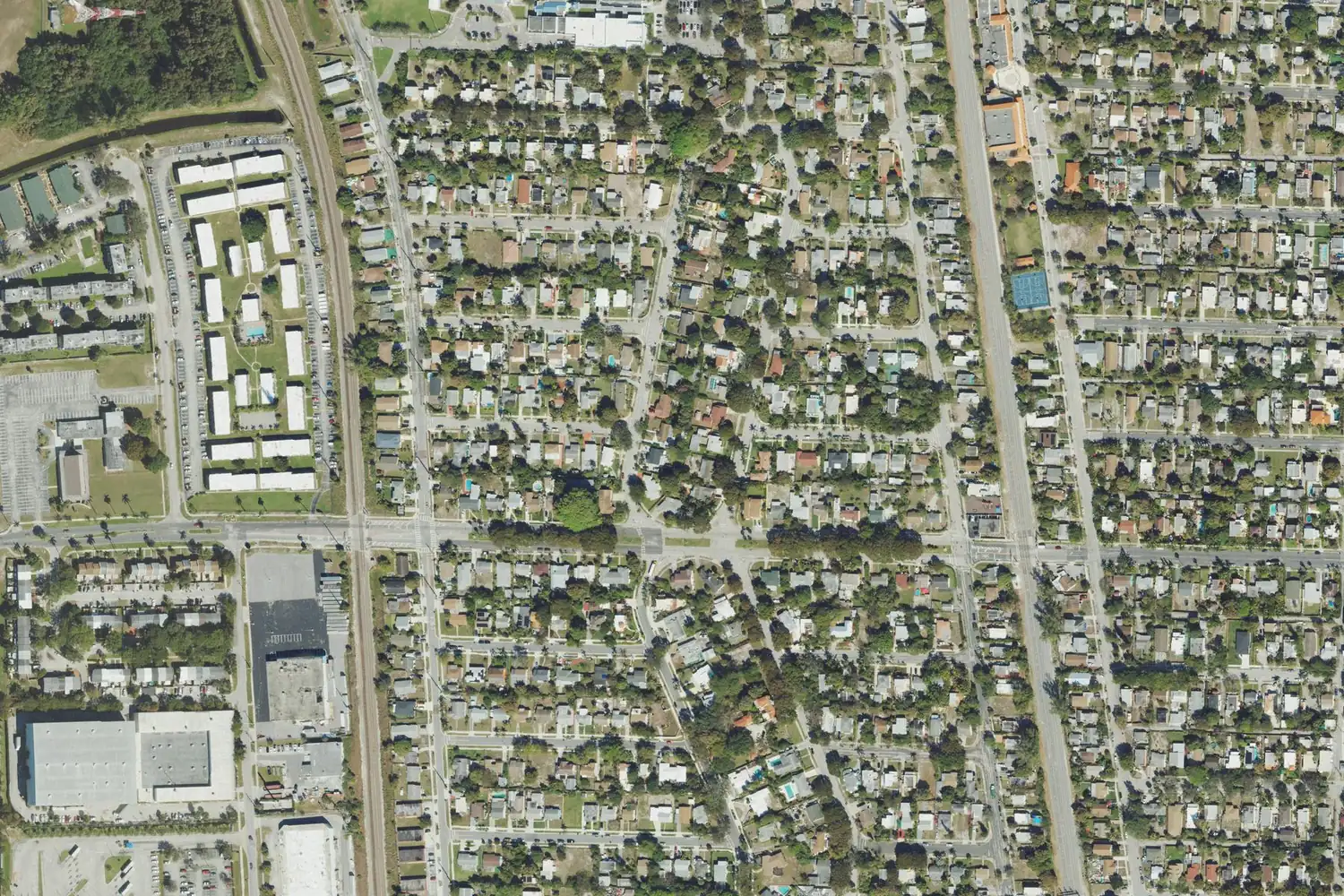 The houses and tree-lined streets of Northwood Hills from above, with the rail corridor used by Tri-Rail at left, in West Palm Beach.