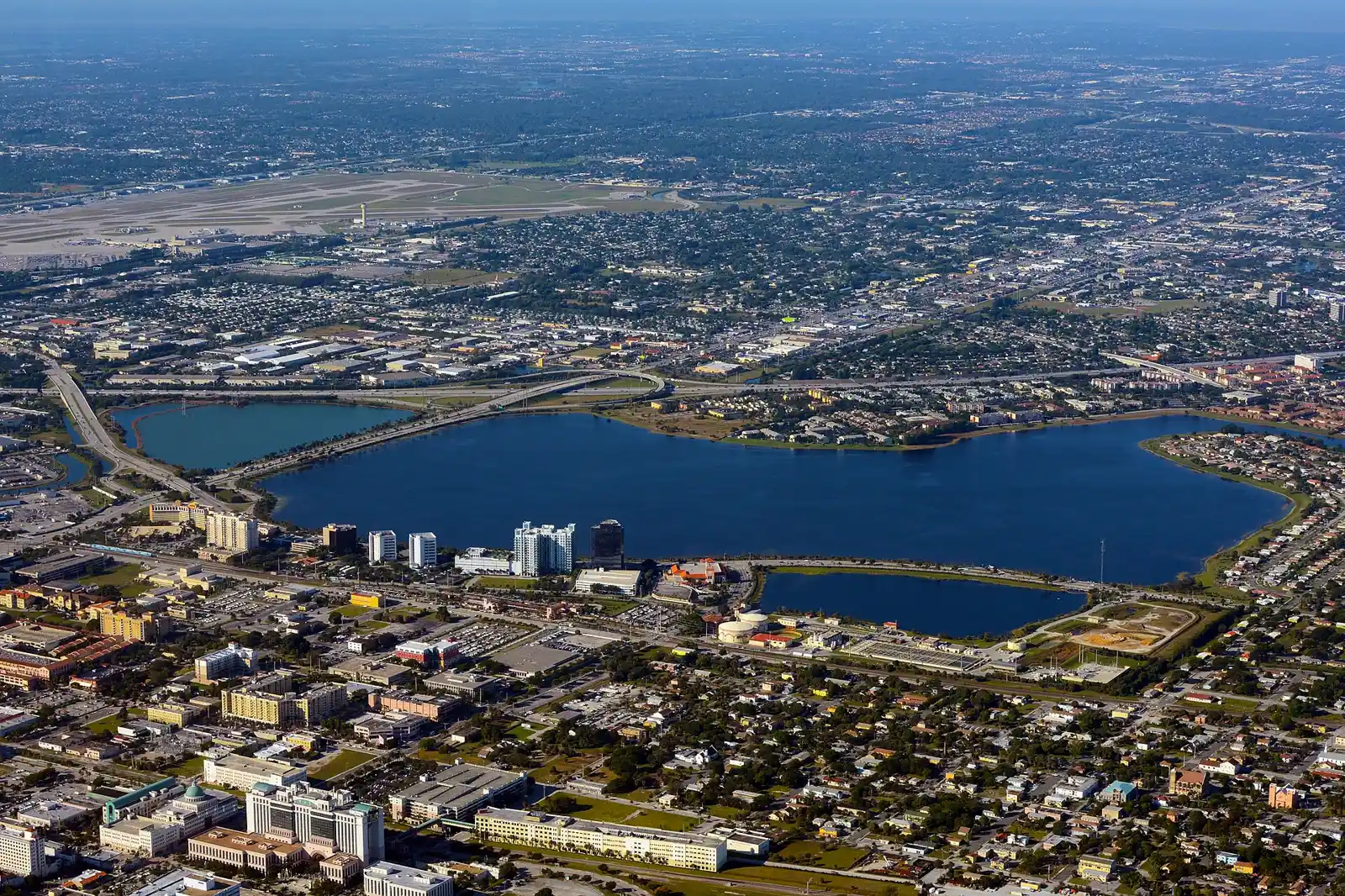 Aerial view of Clear Lake in West Palm Beach, with downtown in the foreground and the airport beyond.