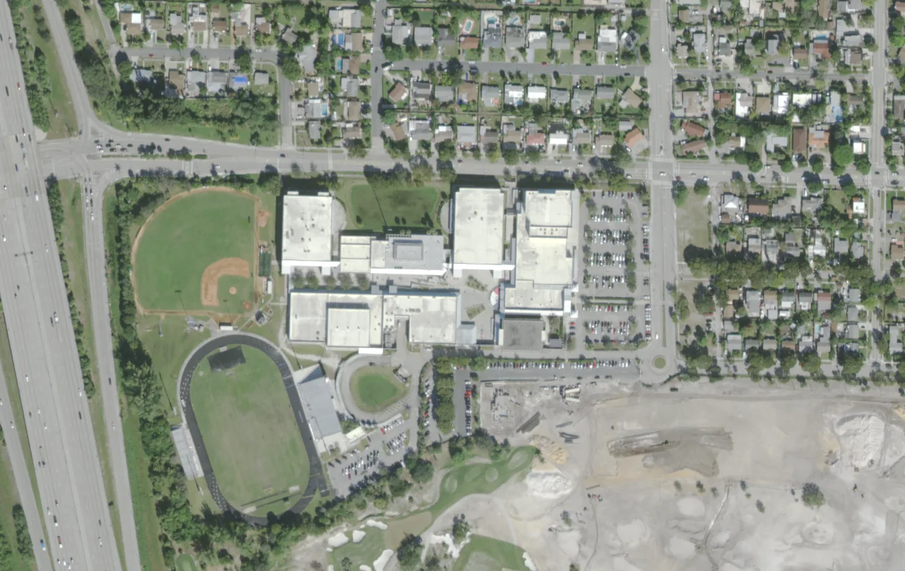 Forest Hill Community High's buildings, track and baseball field beside I-95 on Parker Avenue in West Palm Beach, seen from the air