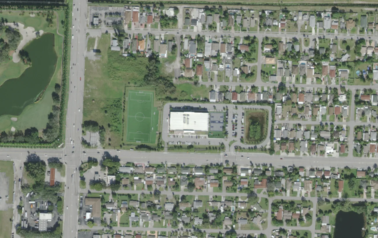 The SLAM Palm Beach and Somerset Academy Lakes campus on Summit Boulevard west of West Palm Beach, seen from the air
