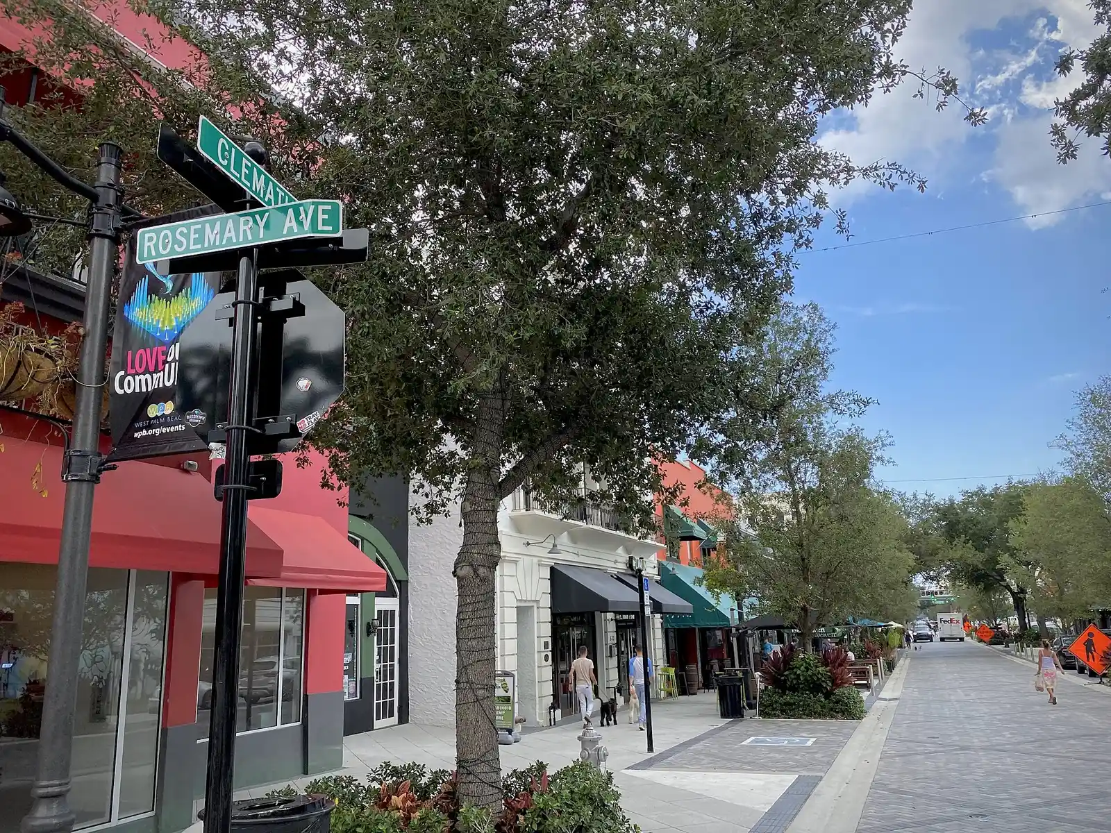 Shops and sidewalk seating at Clematis Street and Rosemary Avenue in downtown West Palm Beach.