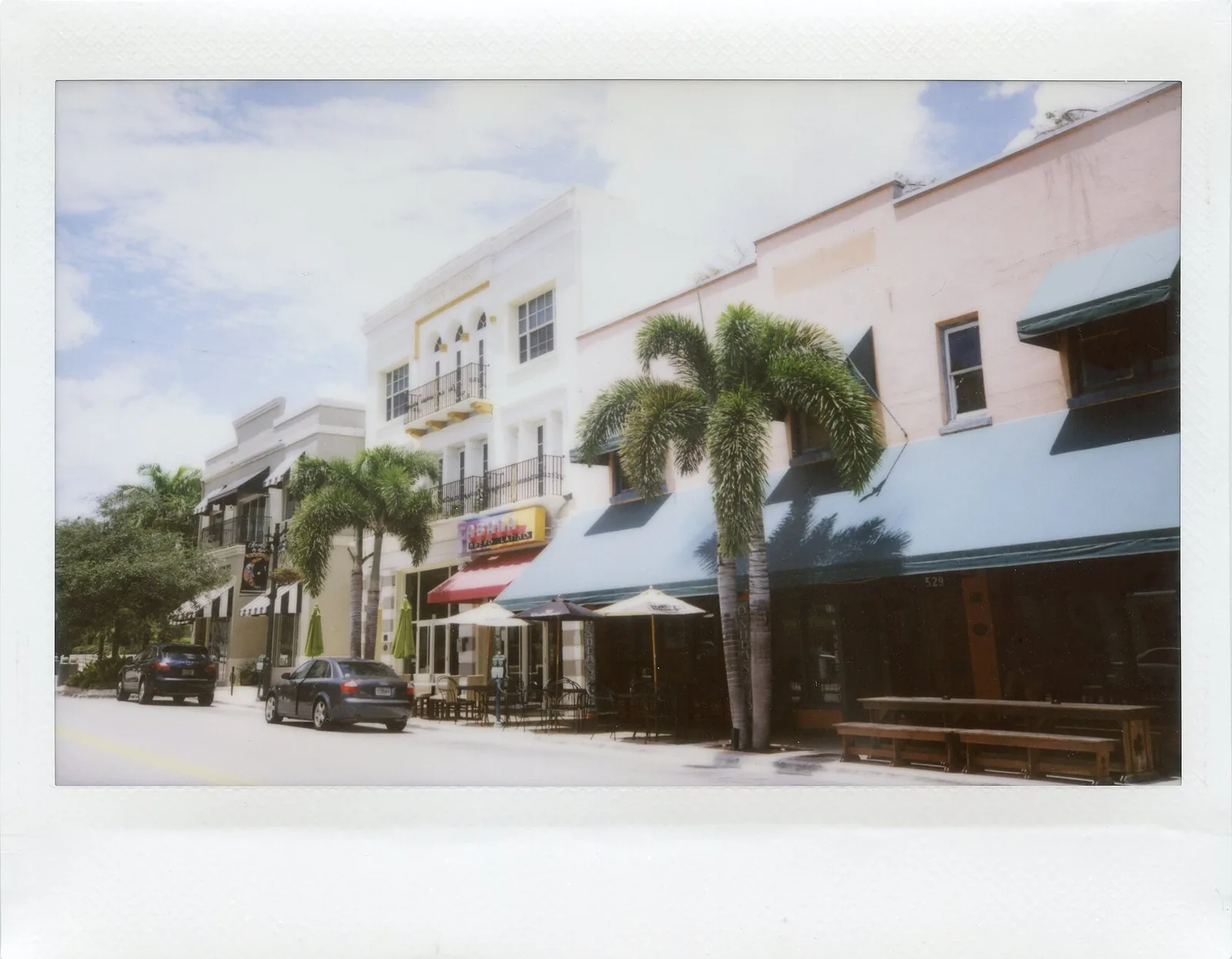 Sidewalk tables and umbrellas outside restaurants on the 500 block of Clematis Street in downtown West Palm Beach.